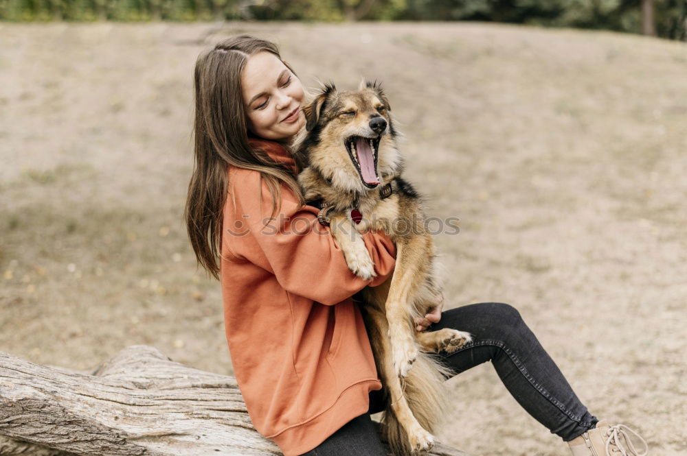 Similar – Happy smiling dog with its pretty young owner