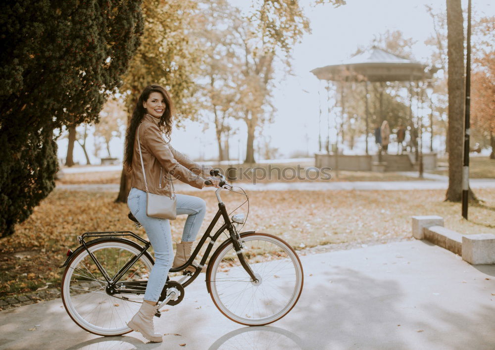 Similar – Image, Stock Photo Black young woman riding a vintage bicycle