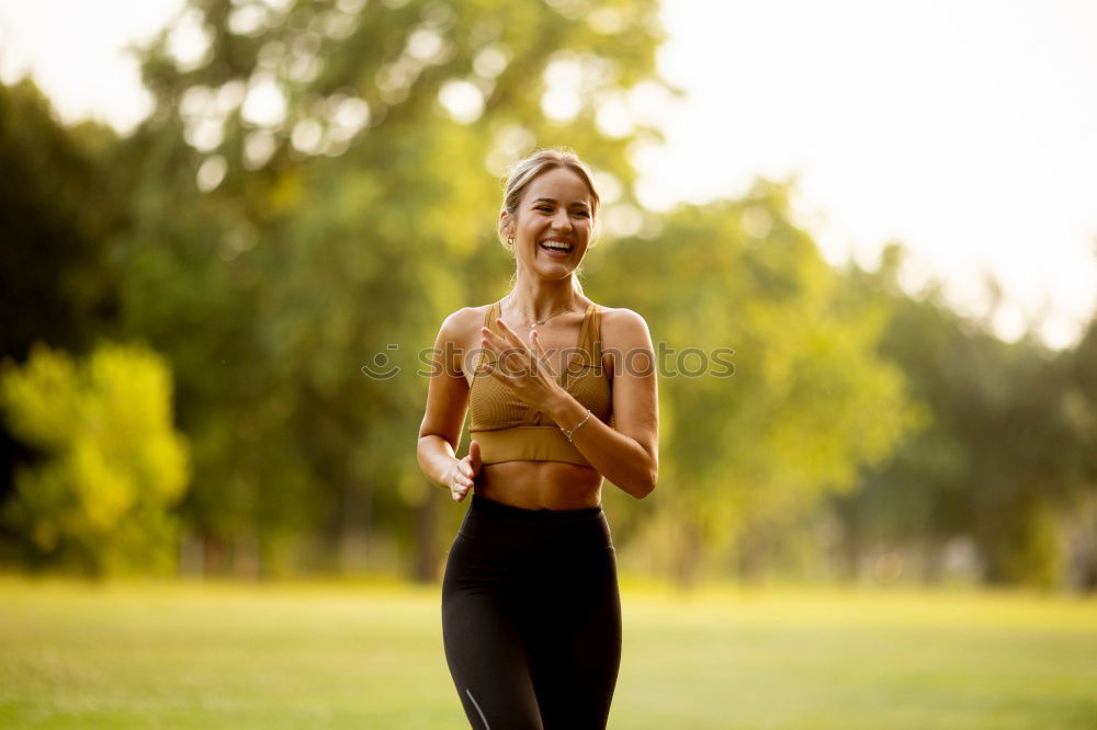 Similar – Healthy Woman Jogging in the Park with her Dog