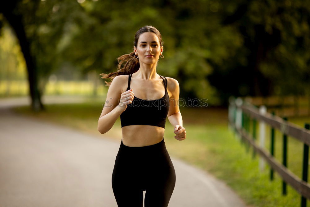 Similar – Athletic Woman in Running Exercise at the Park