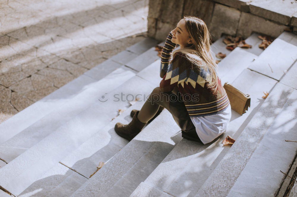 Similar – Trendy girl posing on stairs