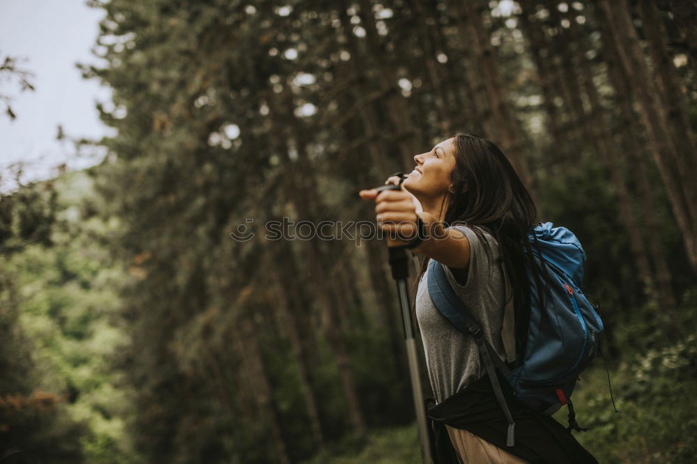 Similar – Woman hanging out of car in forest