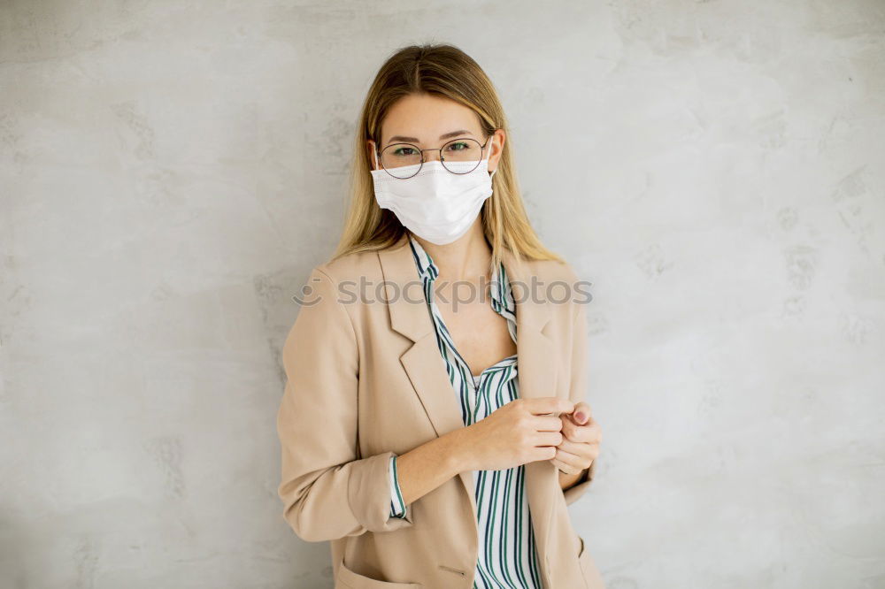 Similar – Female teenager in protective mask standing near electric scooter