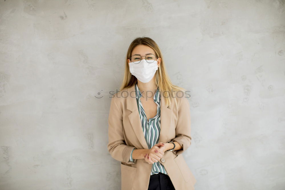 Similar – Female teenager in protective mask standing near electric scooter