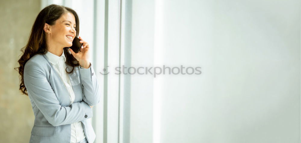 Similar – Image, Stock Photo Young beautiful woman reflected in a huge window