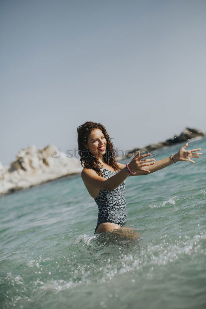 Similar – Young woman in a pool enjoying the water