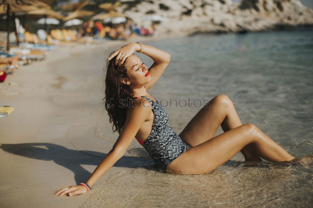 Similar – Image, Stock Photo Young woman with a swimming suit walking in a wooden foot bridge at the beach