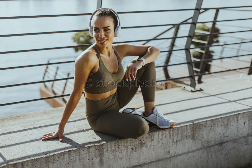 Similar – Fit smiling female adult resting after exhausting training