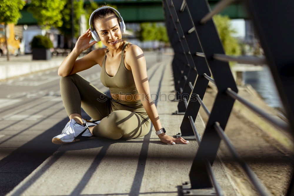 young woman runner eating an apple