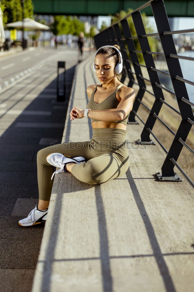 Similar – young woman runner eating an apple