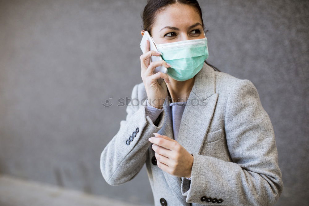 Similar – Female teenager in protective mask standing near electric scooter