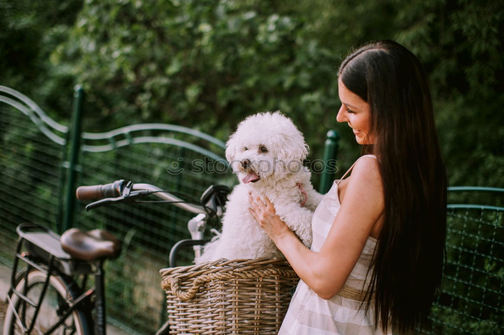 Similar – young woman with her dog at the park. she is kissing the dog. autumn season