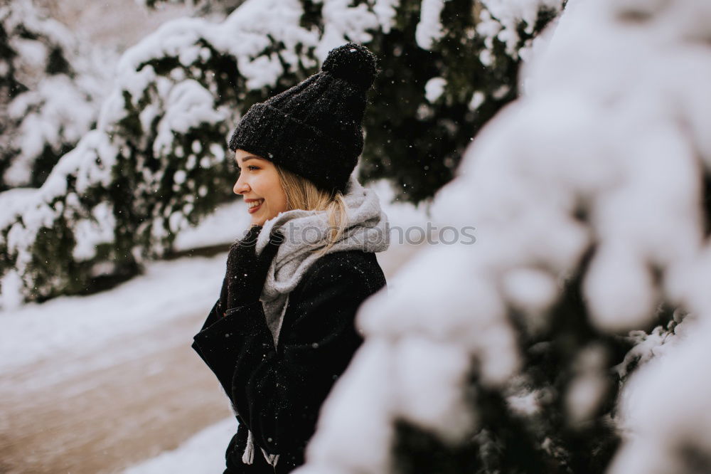 Similar – Young woman wrapped warm against the cold