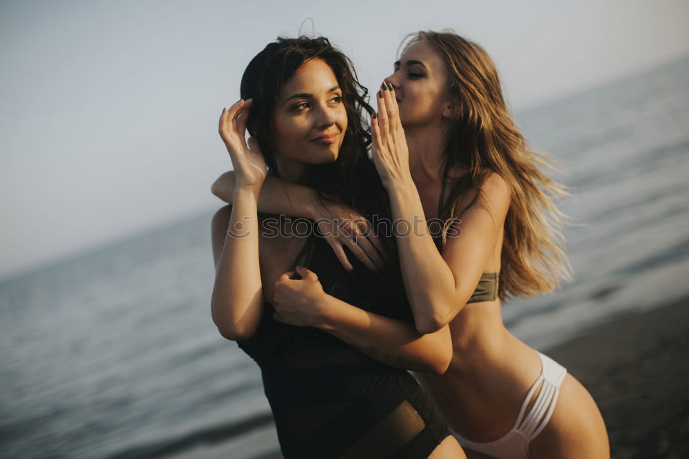 Similar – Image, Stock Photo Two teenage girls having fun on beach pulling faces