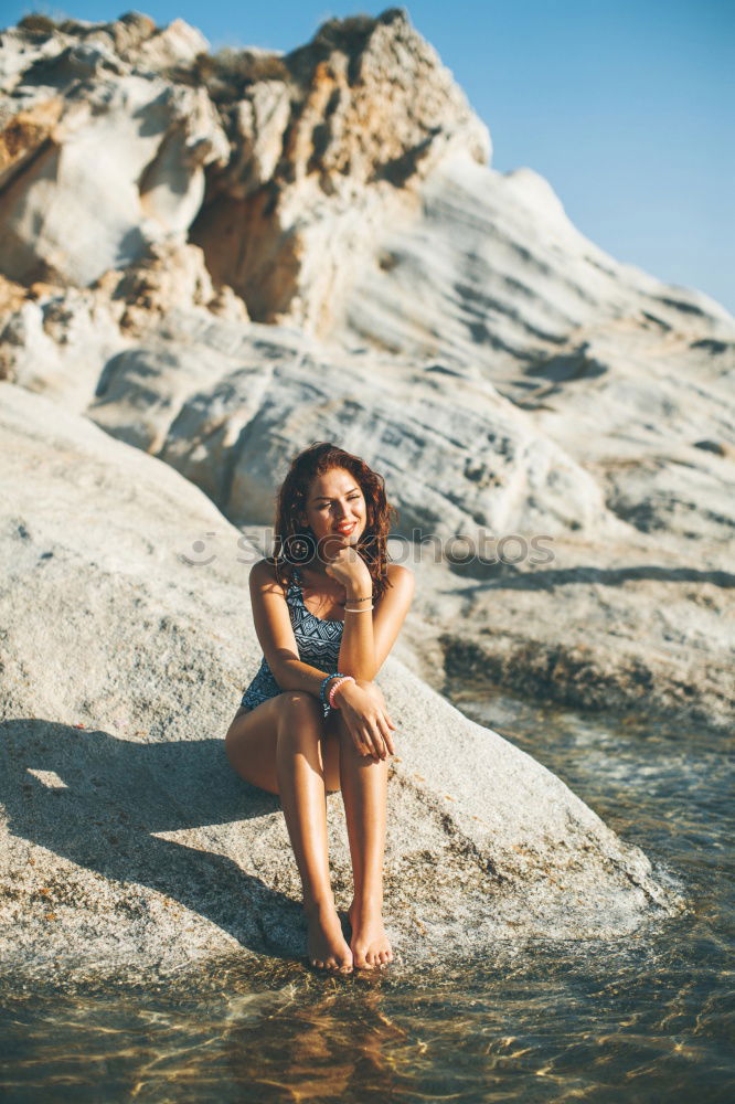 Similar – Happy girl posing on the stones of a river