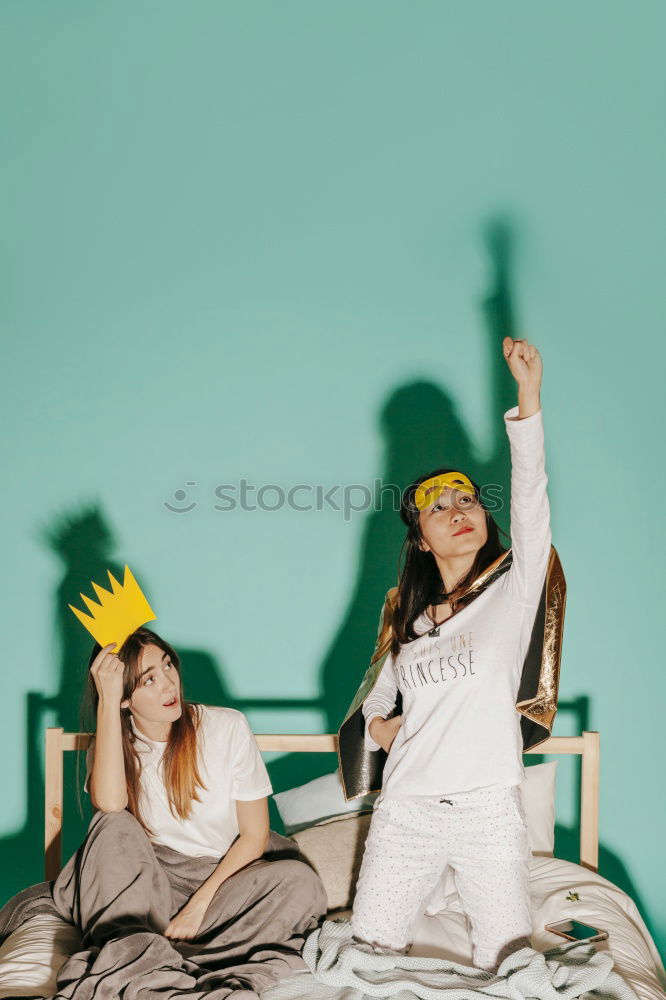 Similar – Cheerful women posing at fence