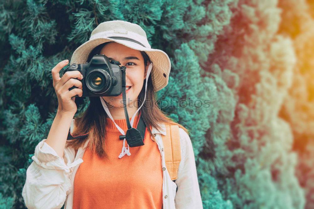 Similar – Cropped woman with vintage old camera