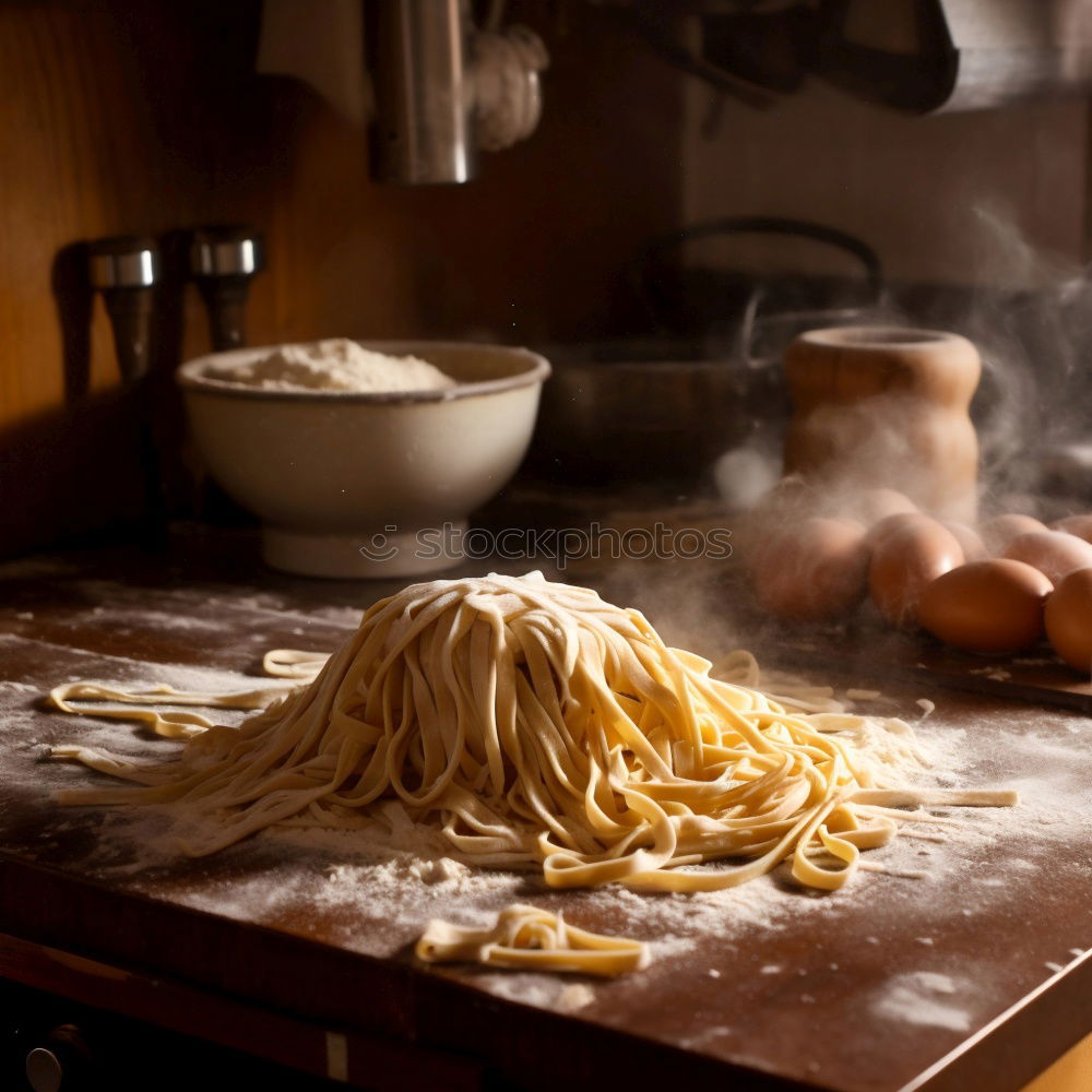 Similar – Image, Stock Photo Making homemade taglatelle with a pasta rolling cutter