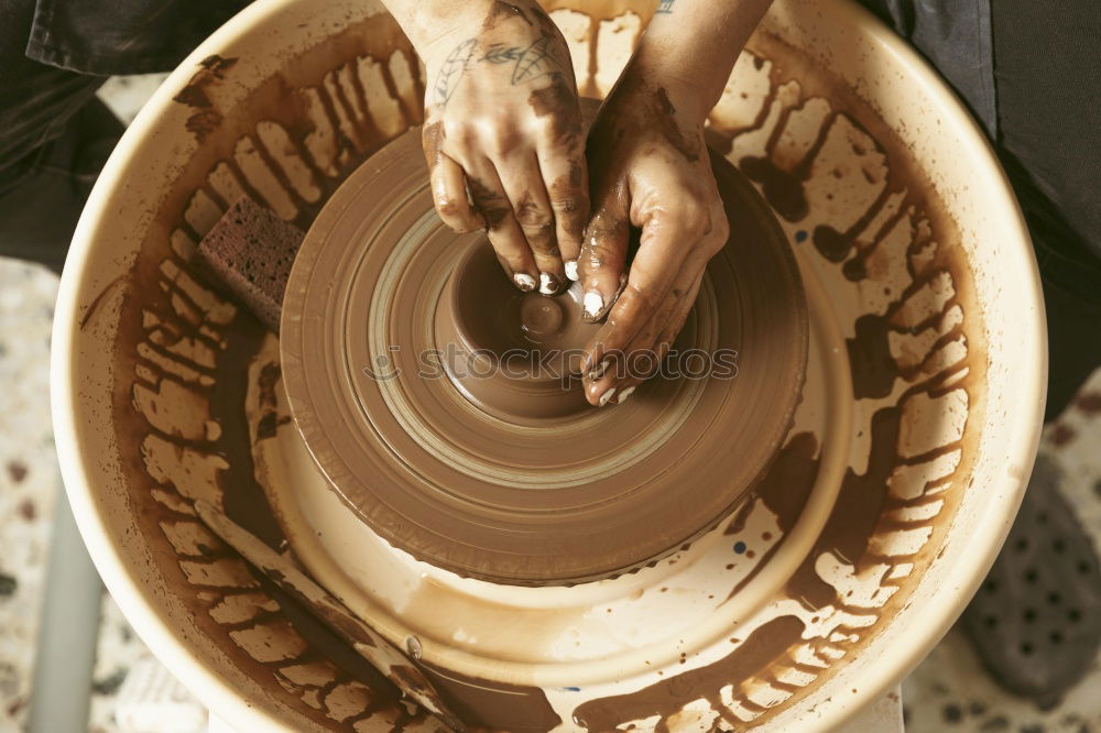 Similar – Hands of woodcarver make ??wooden bowl