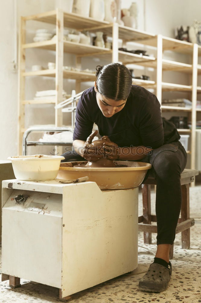 Similar – Carpenter cutting wooden board at his workshop