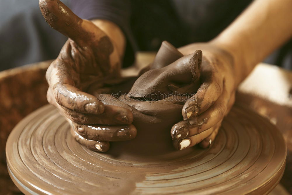 Similar – Potter making the pot in traditional style. Close up.