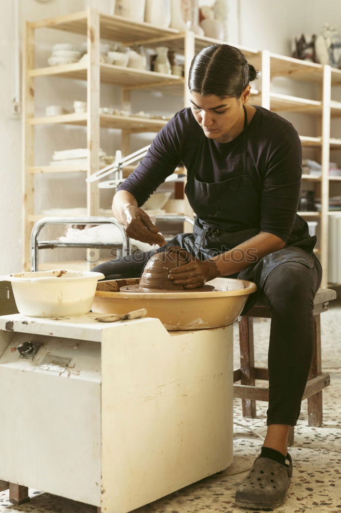 Similar – Carpenter cutting wooden board at his workshop