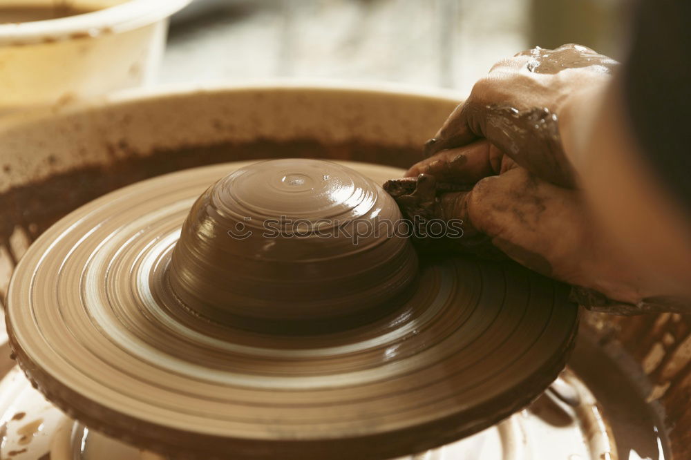 Similar – Potter making the pot in traditional style. Close up.