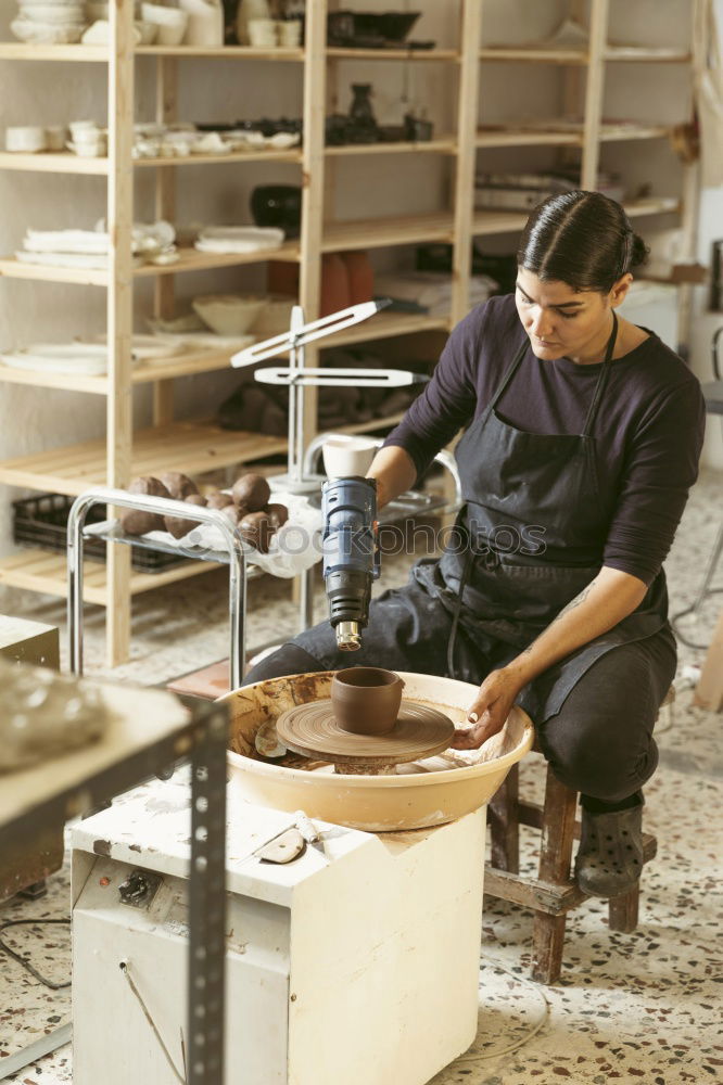 Similar – Carpenter cutting wooden board at his workshop