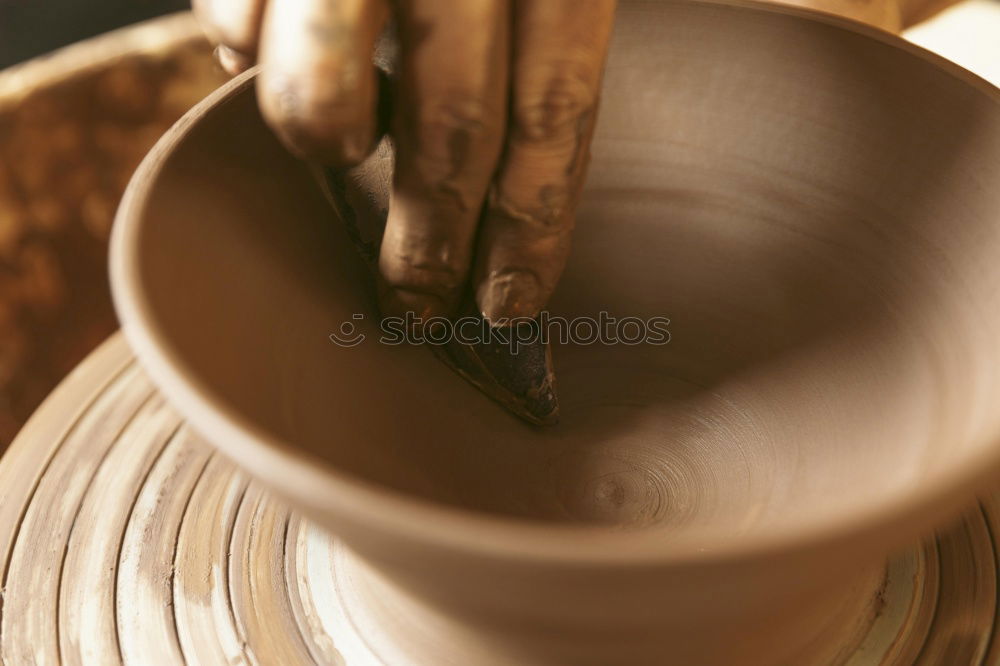 Similar – Hands of woodcarver make ??wooden bowl