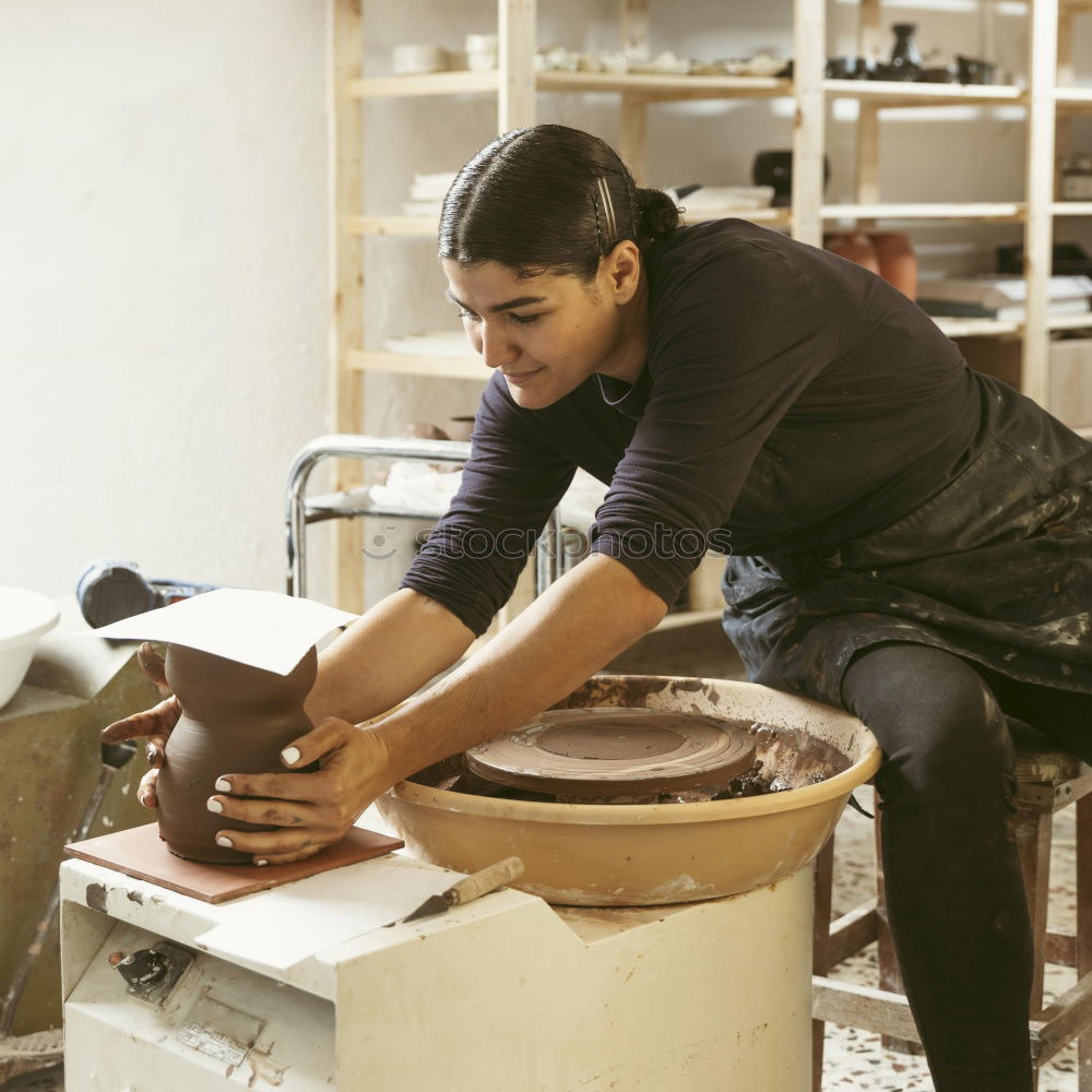 Similar – Image, Stock Photo Focused child polishing wood in workshop with unrecognizable grandfather