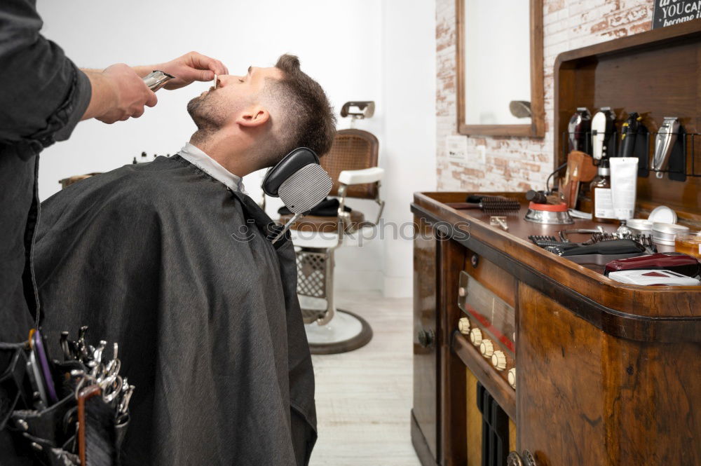 Similar – Image, Stock Photo Barber using grooming machine
