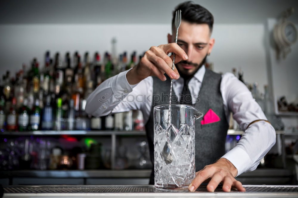 Similar – Barman is making cocktail at night club.