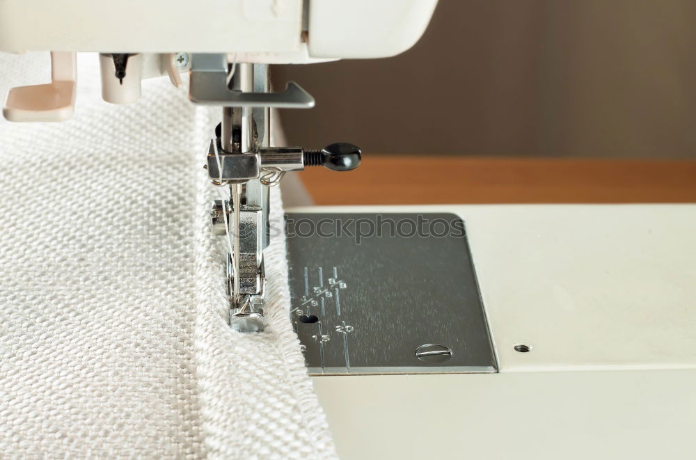 Similar – Image, Stock Photo Woman sewing on a sewing machine