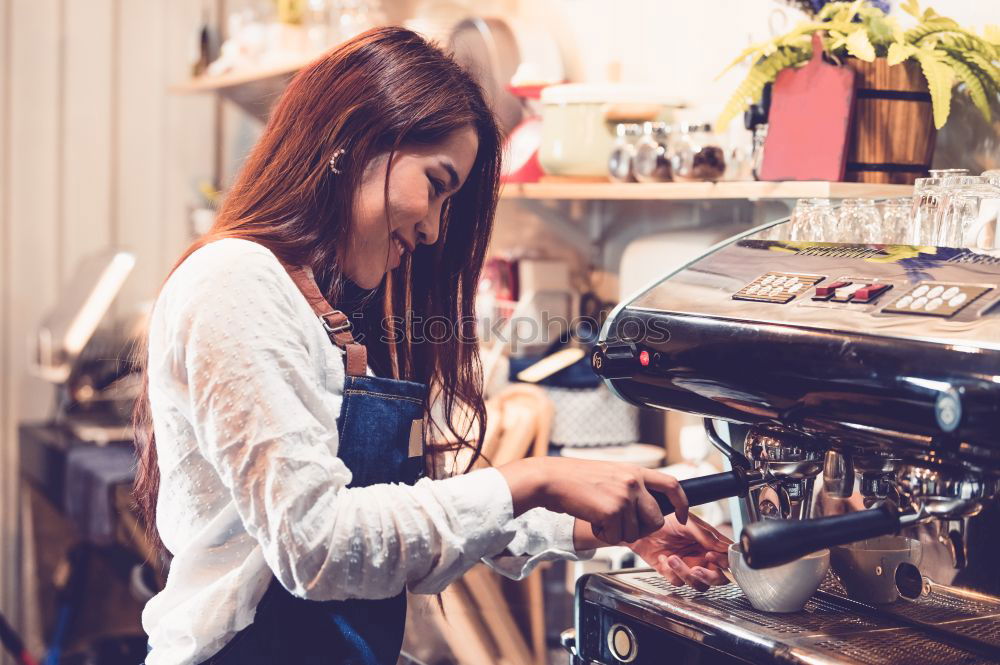 Similar – smiling Barista girl prepares coffee