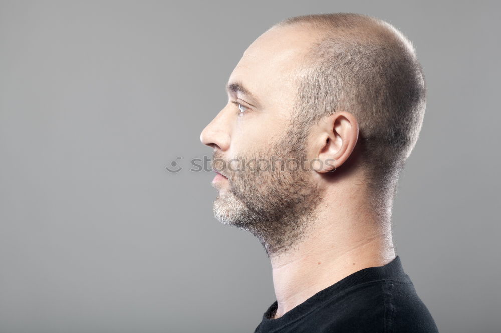 Similar – Young bald guy on black background