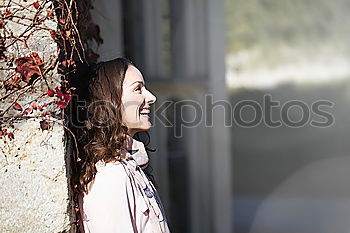 Similar – two women friends sitting down at stairs outdoors using laptop