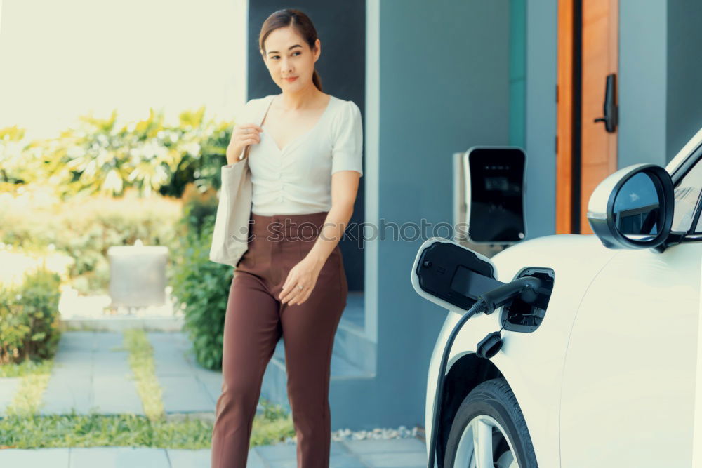 Similar – Woman sitting at laundry machine