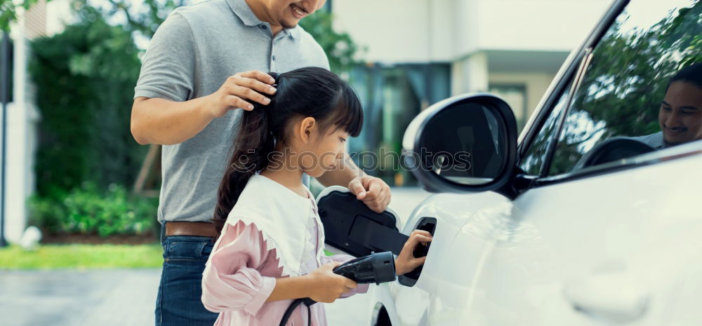 Similar – Happy father and son getting ready for road trip on a sunny day.