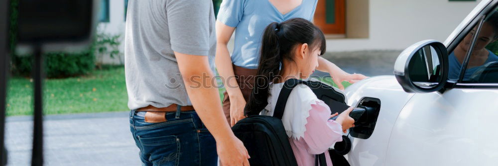 Similar – Happy father and son getting ready for road trip on a sunny day.