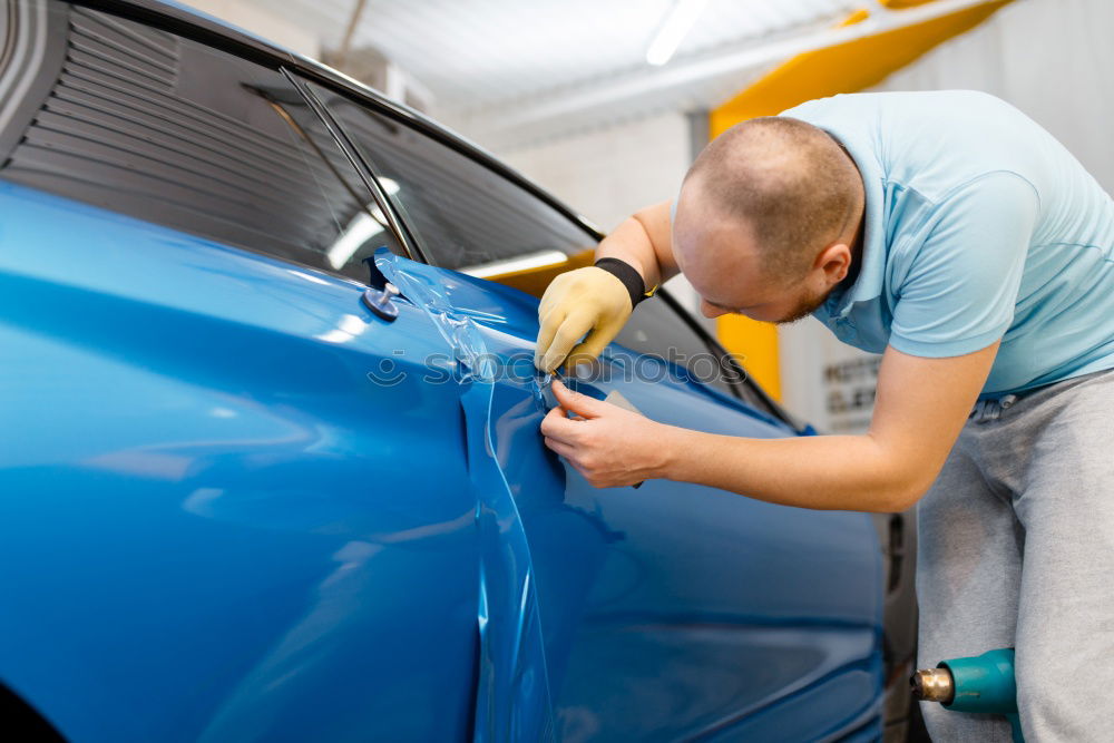 Similar – Image, Stock Photo Professional Mechanic Repairing Car Engine.