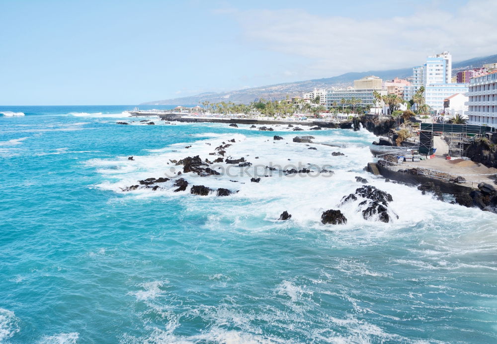 Scenic aerial view of city on ocean shore