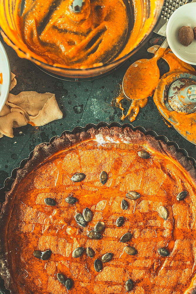 Similar – Image, Stock Photo Pumpkin cake preparation with ingredients and kitchen utensils