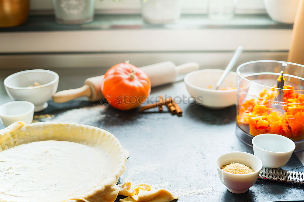 Image, Stock Photo Pumpkin cake preparation on kitchen table at the window