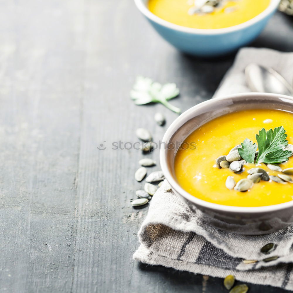 Similar – Fresh pumpkin soup in three bowls on a wooden table