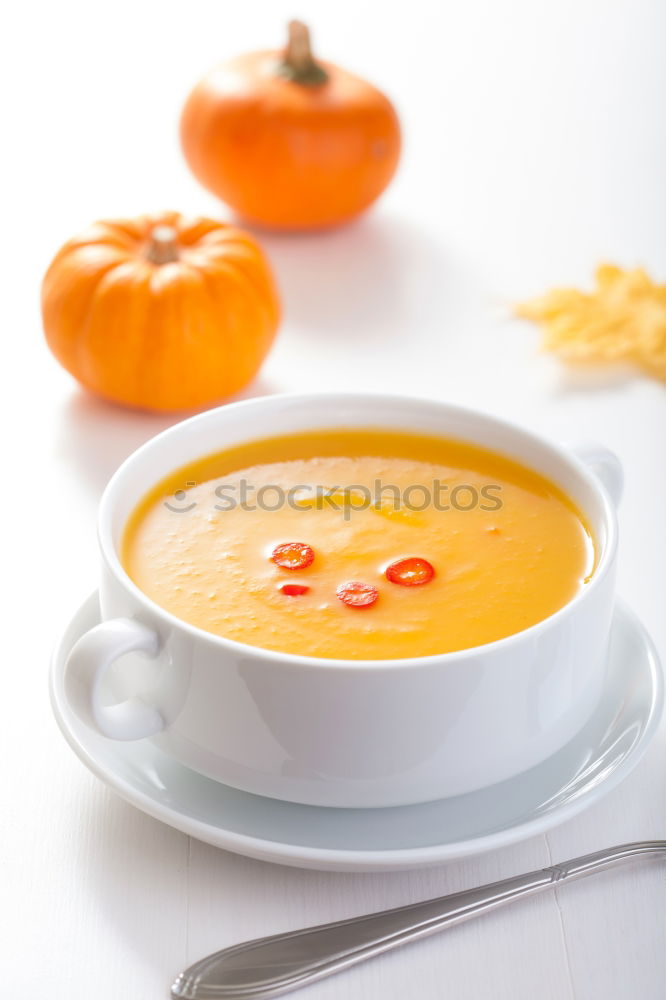 Similar – Fresh pumpkin soup in three bowls on a wooden table