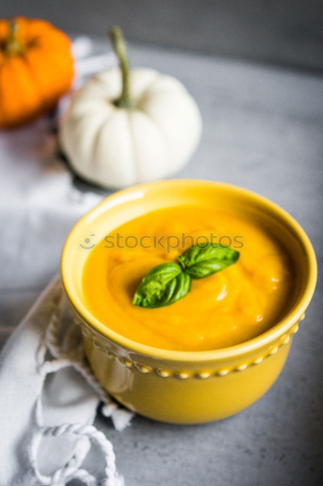 Similar – Fresh pumpkin soup in three bowls on a wooden table