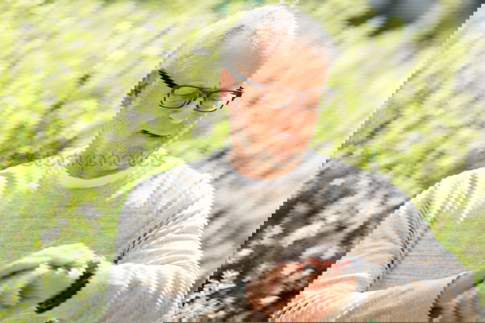 Similar – Image, Stock Photo Portrait of a senior man using a smart watch.