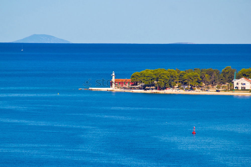 Similar – island boat Ocean Sky blue