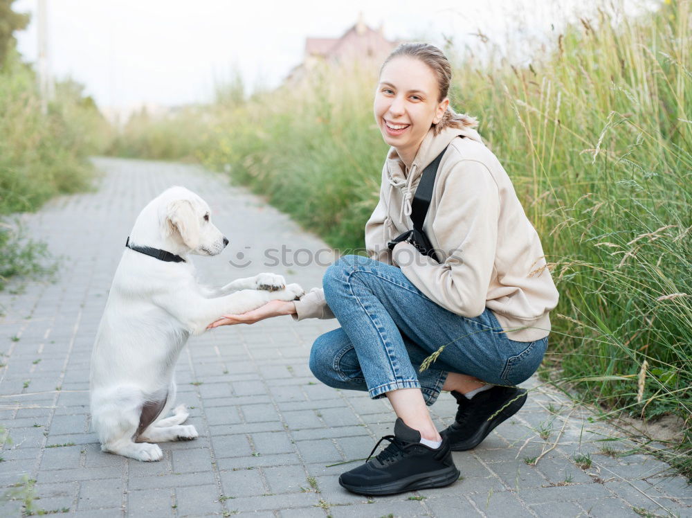 Similar – Happy smiling dog with its pretty young owner