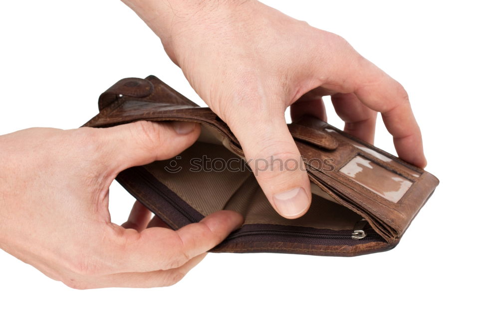 Similar – two female hands hold brown leather open empty wallet for cash